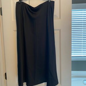 Satiny black below knee skirt